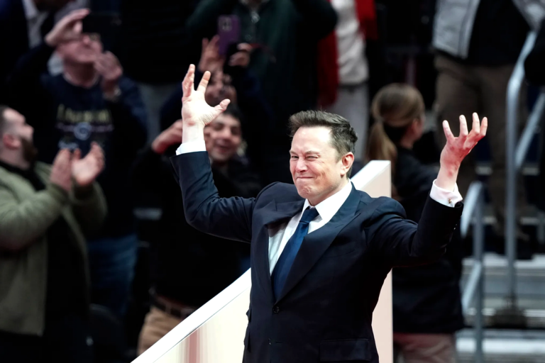 Elon Musk celebrates during a public appearance amid announcements from Elon Musk’s Department of Government Efficiency on federal contract cuts.