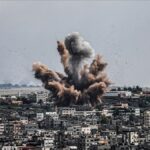 A massive explosion rises over Gaza City following an airstrike during the Israel-Palestine conflict April 2025, symbolizing the intensifying violence.