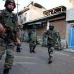 Indian soldiers patrol a tense neighborhood in Kashmir amid the ongoing India-Pakistan conflict escalation.