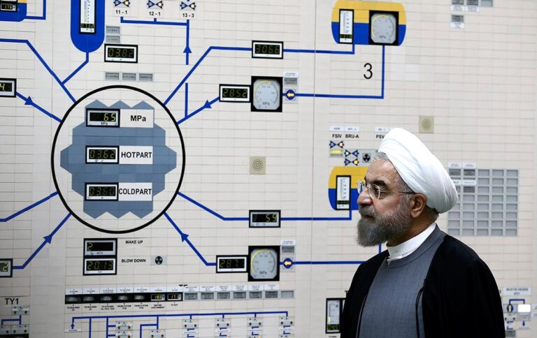 Iranian leader Hassan Rouhani stands inside a nuclear facility control room, symbolizing Iran’s nuclear ambitions amid ongoing Iran-U.S. nuclear talks.