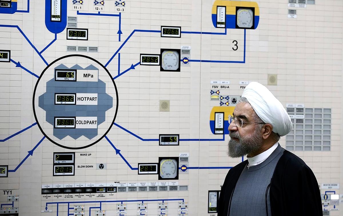 Iranian leader Hassan Rouhani stands inside a nuclear facility control room, symbolizing Iran’s nuclear ambitions amid ongoing Iran-U.S. nuclear talks.