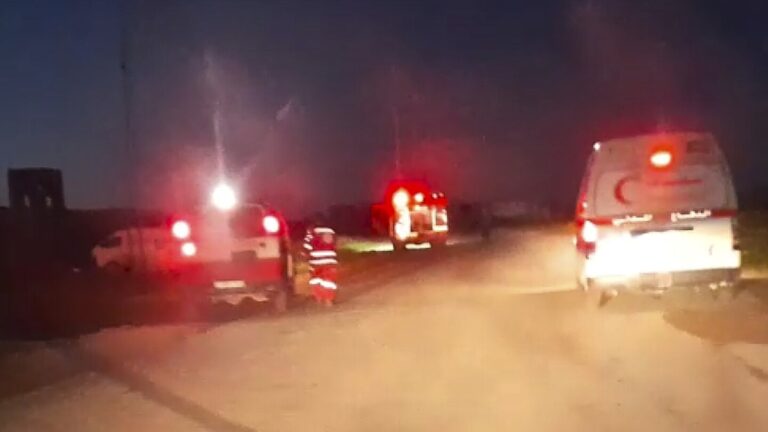 Emergency vehicles with flashing red lights seen at night in Rafah, moments before the deadly strike investigated in the Israeli probe into killings of Palestinian medics.
