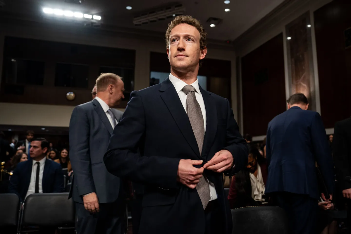 Mark Zuckerberg stands before a congressional hearing, buttoning his jacket before testifying on Meta’s antitrust case and his $450M settlement offer.