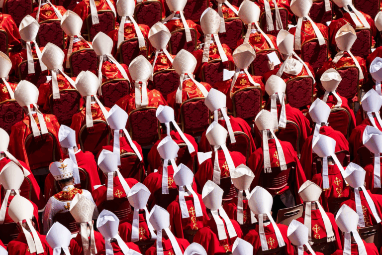 Rows of cardinals in red vestments and white mitres gather for a ceremony ahead of the 2025 papal conclave.