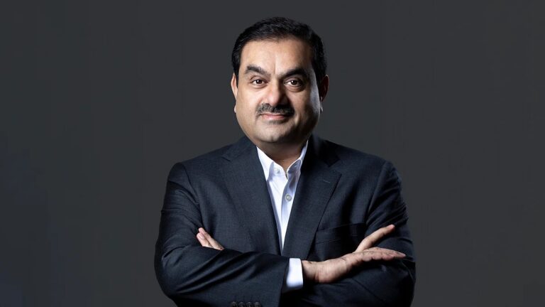 Gautam Adani poses in a formal black suit amid mounting attention on the Adani bribery case in the U.S.