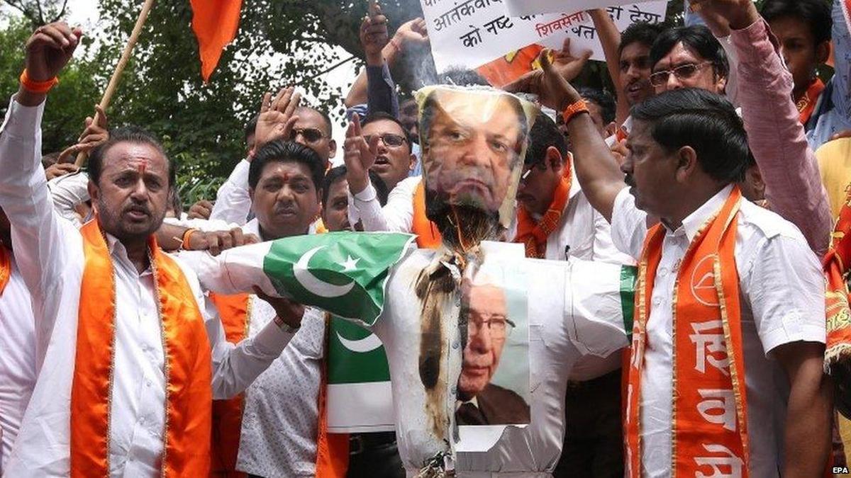 Indian nationalist protesters burn effigies of Pakistani leaders during demonstrations opposing the India Pakistan ceasefire.