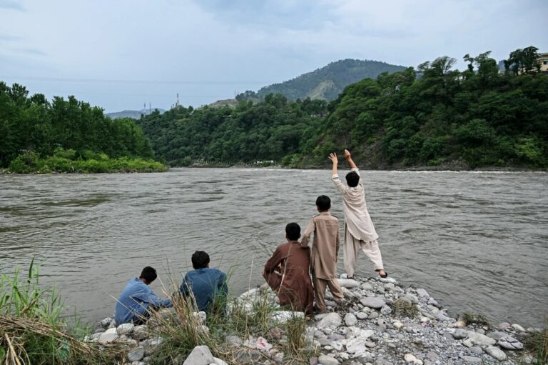 Children gather along the Indus River in Pakistan amid growing concerns over the Indus Waters Treaty suspension.