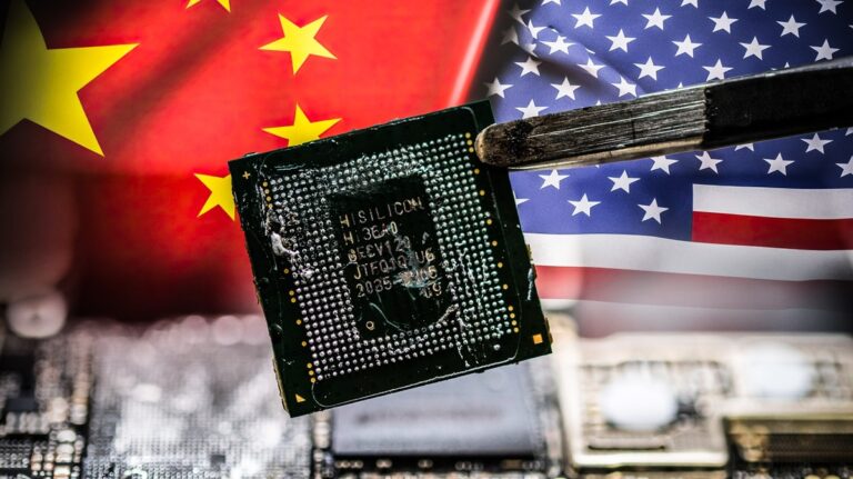 Close-up of a Chinese microchip held against Chinese and U.S. flags—symbolizing tensions over Chinese solar tech exports and cybersecurity.