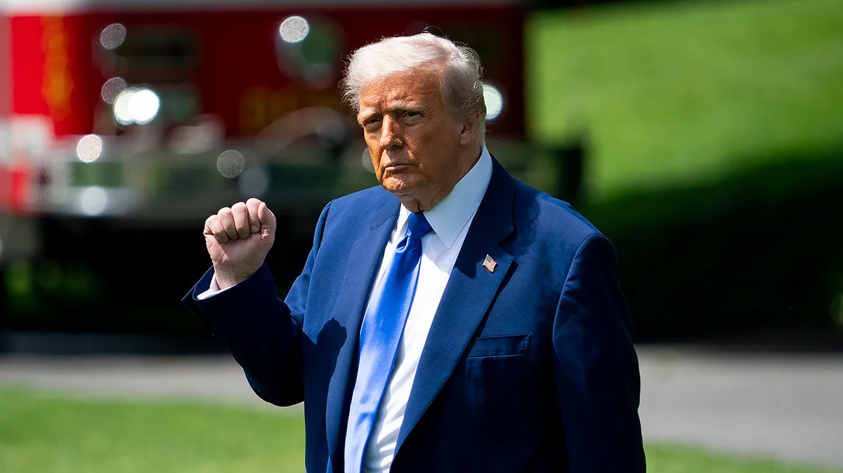Trump raises his fist during a moment tied to the U.S.-UAE defense partnership.